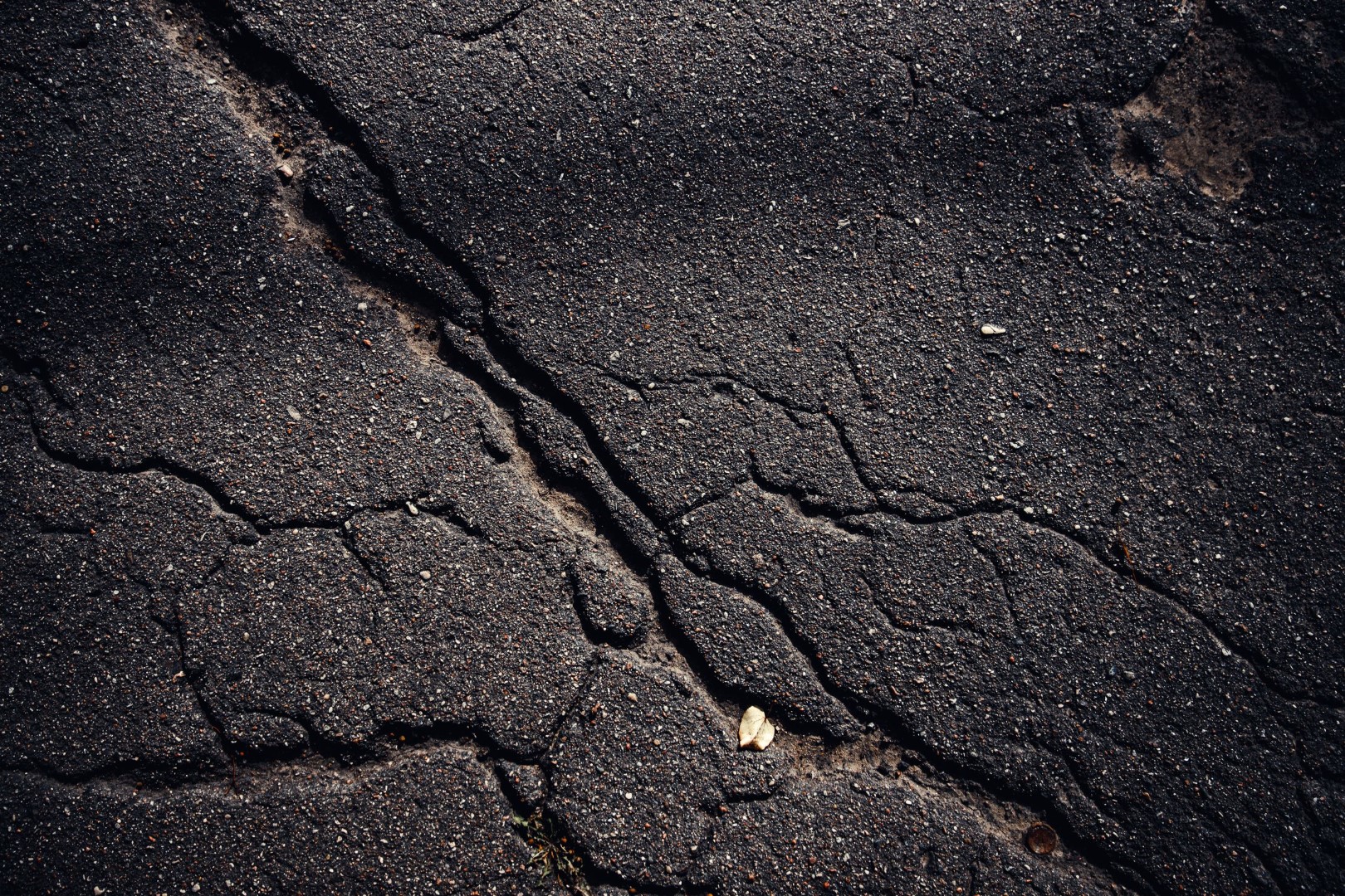 Closeup shot of a textured asphalt background